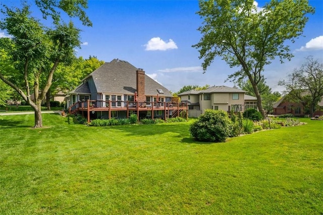 12600 Wenonga Ln, Leawood, KS 66209 - rear view of property featuring a lawn, a wooden deck, and a chimney