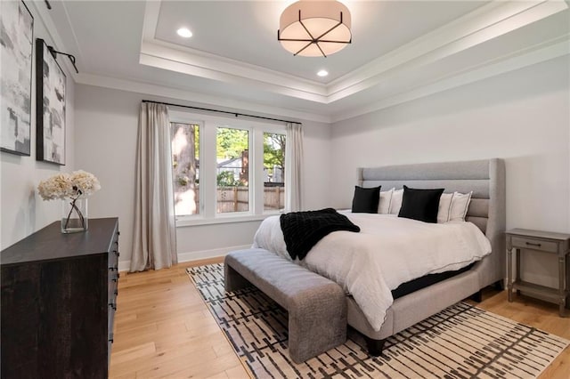 7106 Linden St, Prairie Village, KS 66208 - bedroom featuring a raised ceiling, light wood-style floors, crown molding, and recessed lighting