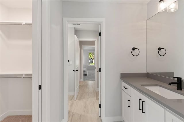 7106 Linden St, Prairie Village, KS 66208 - bathroom with vanity and a walk in closet