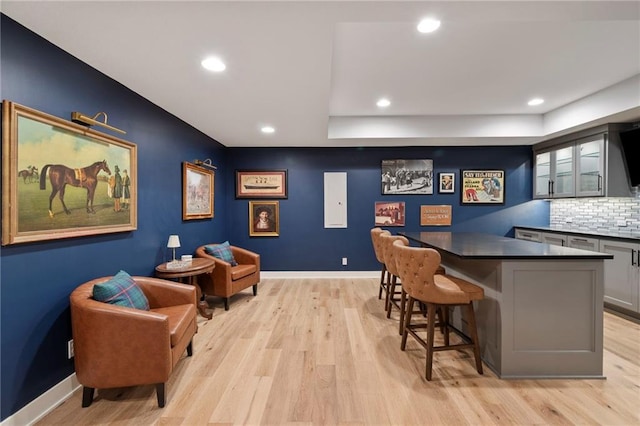 7106 Linden St, Prairie Village, KS 66208 - bar with light wood-style floors, recessed lighting, and tasteful backsplash