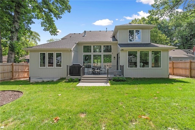7106 Linden St, Prairie Village, KS 66208 - rear view of property featuring a fenced backyard and roof with shingles