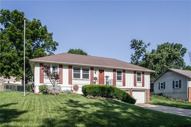 3920 S Milton Dr, Independence, MO 64055 - ranch-style home with driveway, a garage, a front lawn, brick siding, and board and batten siding