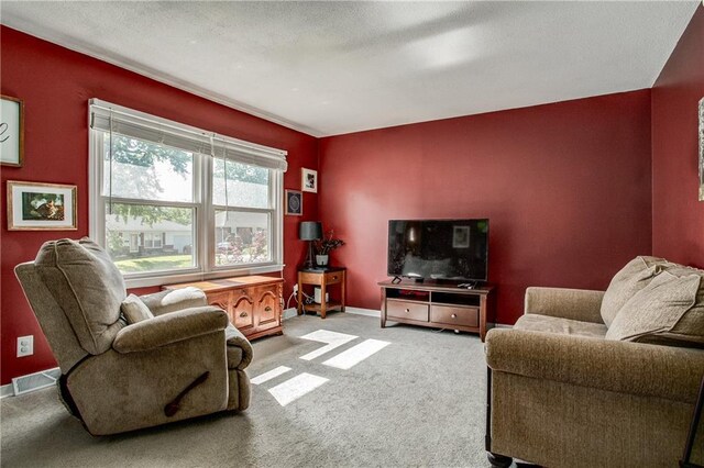 3920 S Milton Dr, Independence, MO 64055 - living area featuring carpet and baseboards