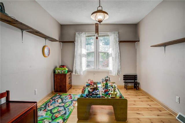 3920 S Milton Dr, Independence, MO 64055 - game room featuring wood finished floors and baseboards