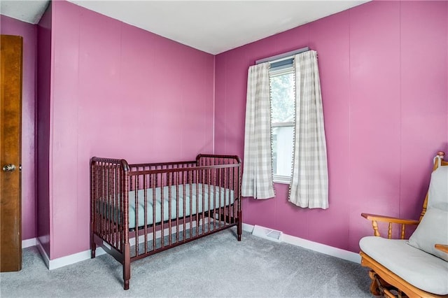 3920 S Milton Dr, Independence, MO 64055 - bedroom featuring carpet flooring, baseboards, and a nursery area