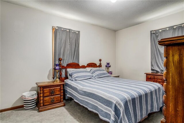 3920 S Milton Dr, Independence, MO 64055 - bedroom featuring carpet and a textured ceiling