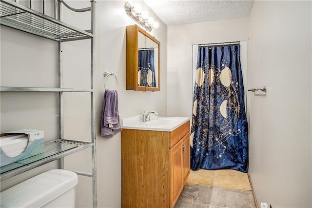 3920 S Milton Dr, Independence, MO 64055 - bathroom with toilet, vanity, a textured ceiling, stone finish flooring, and a shower with curtain