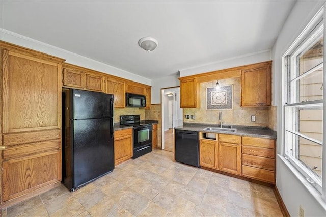 1822 Rankin Dr, Independence, MO 64055 - kitchen with black appliances, tasteful backsplash, and brown cabinets