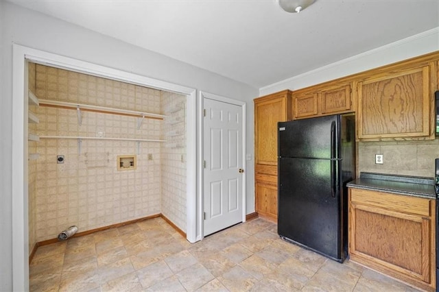 1822 Rankin Dr, Independence, MO 64055 - kitchen with freestanding refrigerator, brown cabinetry, and dark countertops