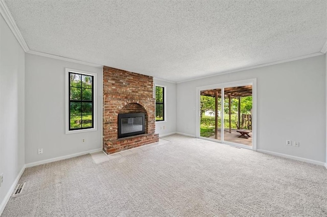 1822 Rankin Dr, Independence, MO 64055 - unfurnished living room featuring carpet floors, a textured ceiling, a brick fireplace, and ornamental molding