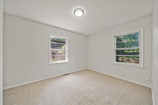 1822 Rankin Dr, Independence, MO 64055 - unfurnished room with a textured ceiling and carpet