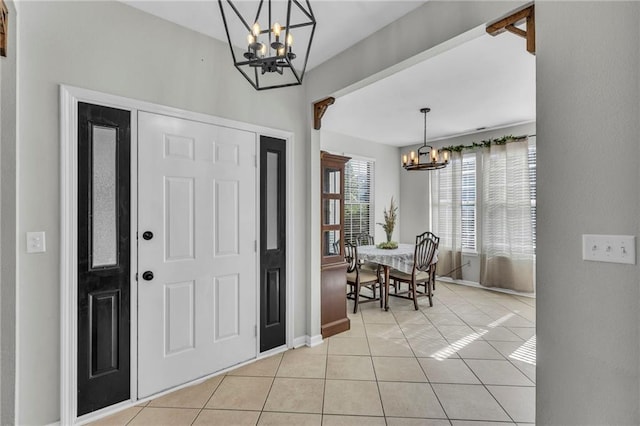 408 Eisenhower Rd, Baldwin City, KS 66006 - entrance foyer with a chandelier and light tile patterned floors