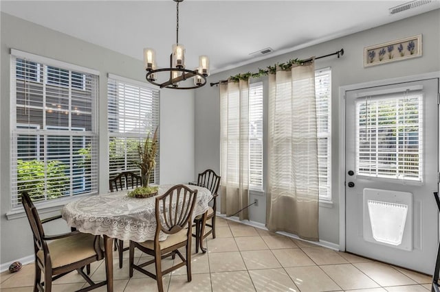 408 Eisenhower Rd, Baldwin City, KS 66006 - dining space with a chandelier, plenty of natural light, and light tile patterned floors