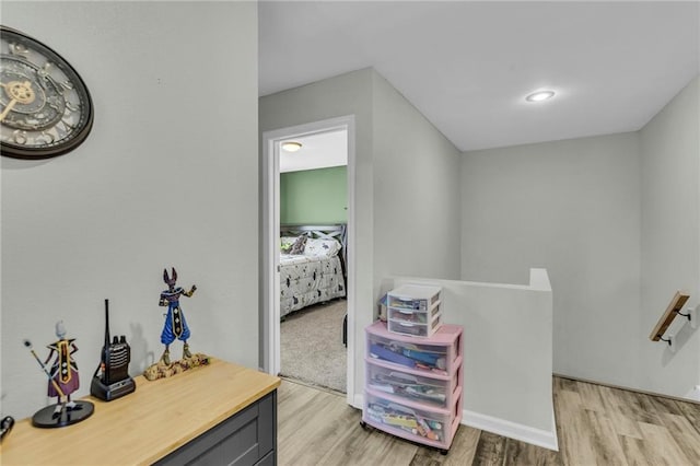 408 Eisenhower Rd, Baldwin City, KS 66006 - corridor with an upstairs landing and light wood-style flooring