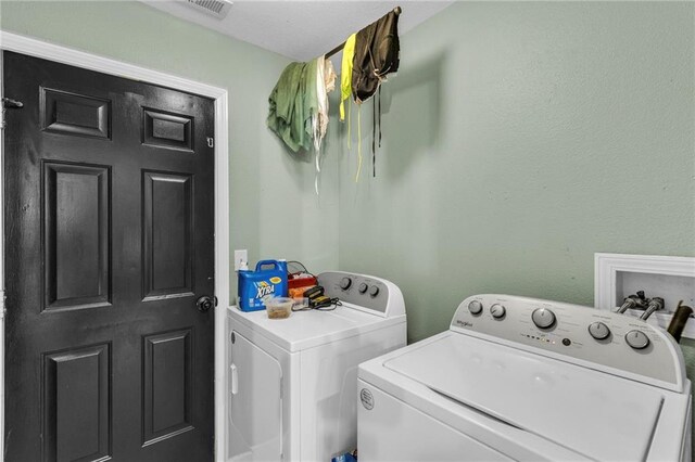 408 Eisenhower Rd, Baldwin City, KS 66006 - laundry area with washing machine and clothes dryer