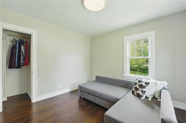 8146 Craig St, Overland Park, KS 66204 - living area with dark wood-style floors and baseboards