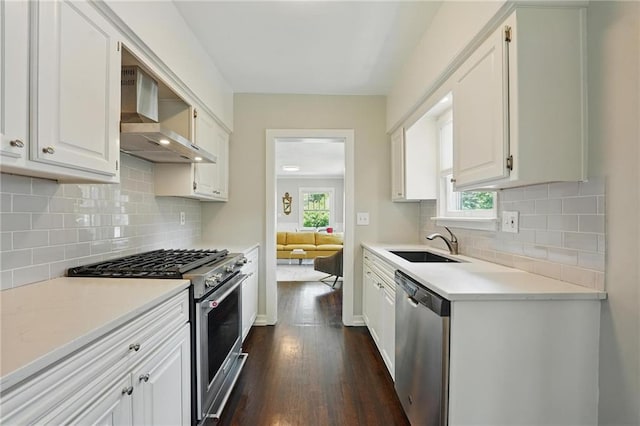8146 Craig St, Overland Park, KS 66204 - kitchen with appliances with stainless steel finishes, dark wood finished floors, light countertops, and white cabinets
