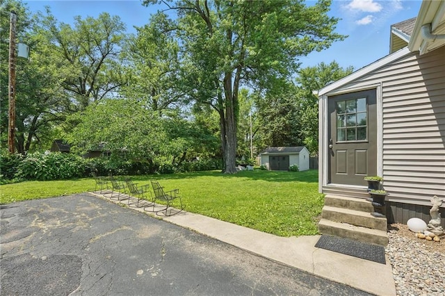8146 Craig St, Overland Park, KS 66204 - view of green lawn featuring entry steps