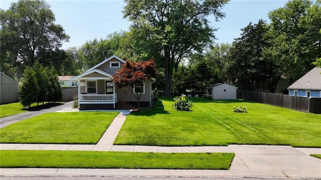 8146 Craig St, Overland Park, KS 66204 - bungalow-style home featuring covered porch and a storage shed