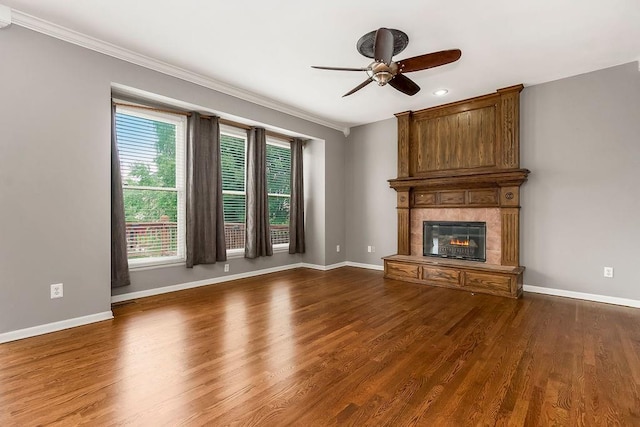 8110 W 144th Pl, Overland Park, KS 66223 - unfurnished living room with crown molding, ceiling fan, a large fireplace, dark wood-type flooring, and recessed lighting