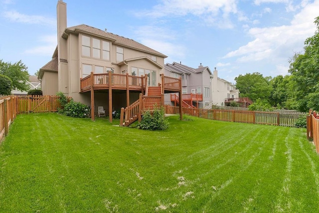 8110 W 144th Pl, Overland Park, KS 66223 - back of house with a fenced backyard, stairs, a deck, a chimney, and a shingled roof