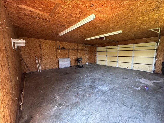 1110 S Plummer Ave, Chanute, KS 66720 - garage featuring a garage door opener