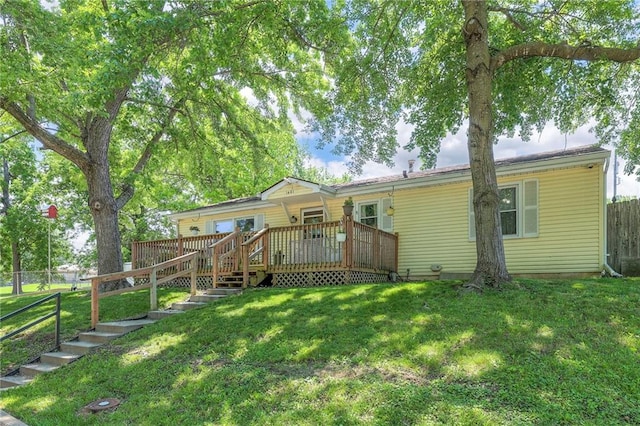 1401 Osage St, Leavenworth, KS 66048 - back of property featuring a wooden deck