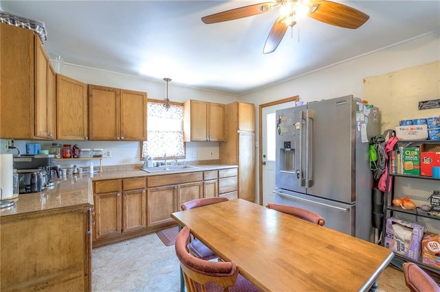 1401 Osage St, Leavenworth, KS 66048 - kitchen featuring stainless steel refrigerator with ice dispenser, ceiling fan, light countertops, pendant lighting, and brown cabinets