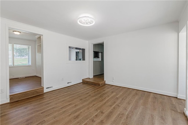 12600 Brooklyn St, Kansas City, MO 64146 - spare room with wood finished floors and ornamental molding