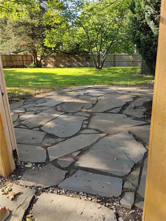 12600 Brooklyn St, Kansas City, MO 64146 - fenced backyard with a patio area