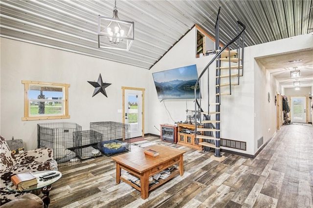 301 NW 1601st Rd, Kingsville, MO 64061 - living room featuring wood finished floors, a chandelier, high vaulted ceiling, stairway, and baseboards