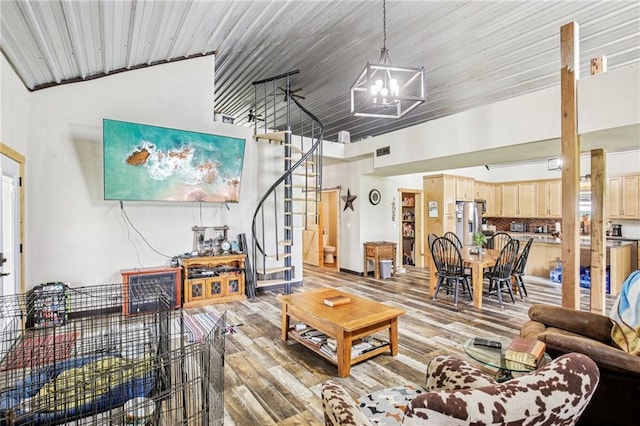 301 NW 1601st Rd, Kingsville, MO 64061 - living room with a chandelier, stairs, and light wood-type flooring