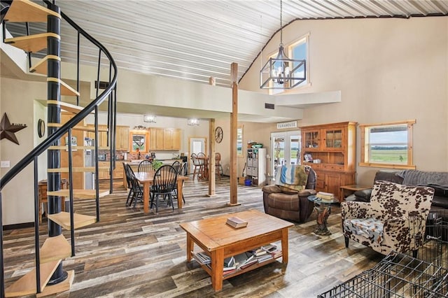 301 NW 1601st Rd, Kingsville, MO 64061 - living area featuring stairway, wood finished floors, a chandelier, french doors, and high vaulted ceiling