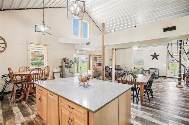 301 NW 1601st Rd, Kingsville, MO 64061 - kitchen featuring light brown cabinets, dark wood-style floors, high vaulted ceiling, a center island, and light countertops