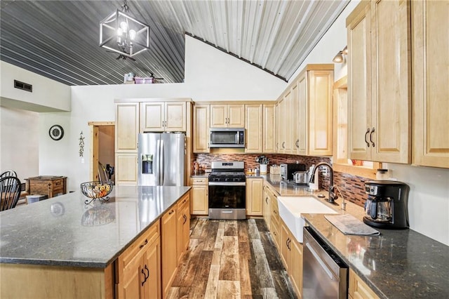 301 NW 1601st Rd, Kingsville, MO 64061 - kitchen featuring appliances with stainless steel finishes, a sink, light brown cabinetry, dark wood-style flooring, and backsplash