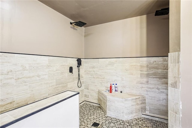 301 NW 1601st Rd, Kingsville, MO 64061 - bathroom featuring a tile shower, tile walls, and a wainscoted wall