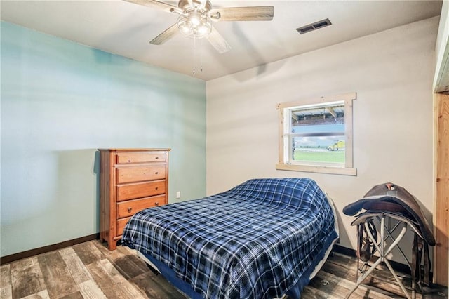 301 NW 1601st Rd, Kingsville, MO 64061 - bedroom featuring baseboards, wood finished floors, and a ceiling fan
