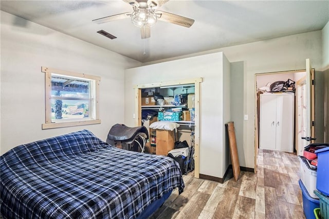 301 NW 1601st Rd, Kingsville, MO 64061 - bedroom featuring light wood finished floors, ceiling fan, and baseboards