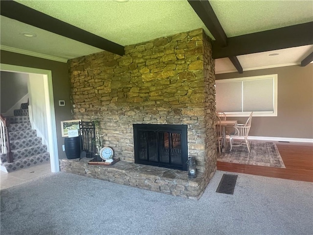 26609 S Red Bud Rd, Freeman, MO 64746 - unfurnished living room with beam ceiling, a fireplace, carpet flooring, stairs, and ornamental molding