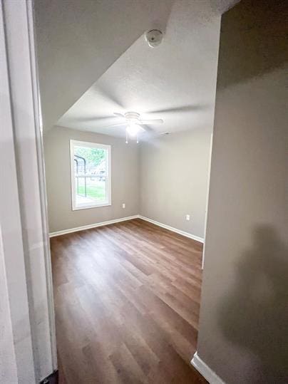717 E Culton St, Warrensburg, MO 64093 - unfurnished room featuring baseboards, wood finished floors, ceiling fan, and a smoke detector