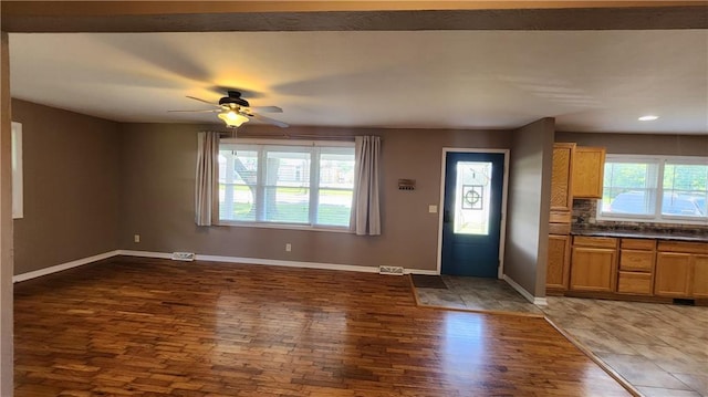 411 S Fulton St, Butler, MO 64730 - foyer entrance featuring wood finished floors, ceiling fan, and recessed lighting
