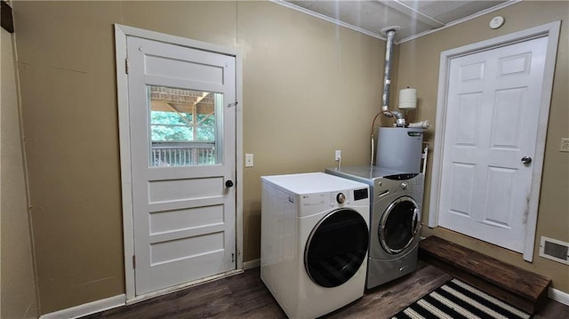 411 S Fulton St, Butler, MO 64730 - washroom with gas water heater, separate washer and dryer, dark wood-style floors, and ornamental molding