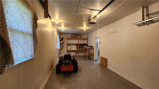 411 S Fulton St, Butler, MO 64730 - garage featuring a garage door opener