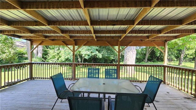 411 S Fulton St, Butler, MO 64730 - wooden terrace with outdoor dining area