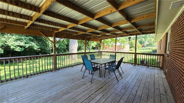 411 S Fulton St, Butler, MO 64730 - wooden deck with outdoor dining space