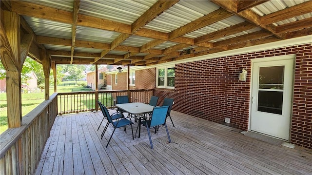 411 S Fulton St, Butler, MO 64730 - wooden deck featuring outdoor dining space