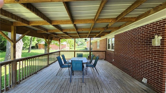 411 S Fulton St, Butler, MO 64730 - deck featuring outdoor dining space and a lawn