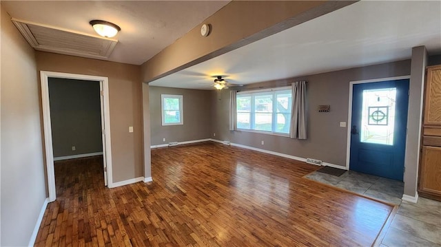 411 S Fulton St, Butler, MO 64730 - entryway featuring wood finished floors and a ceiling fan