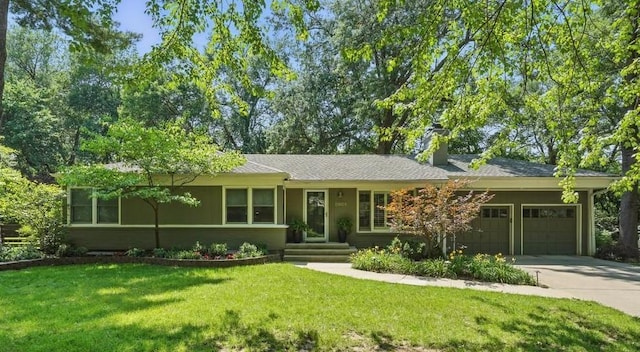 8604 Sagamore Rd, Leawood, KS 66206 - single story home with concrete driveway, an attached garage, a front yard, and a chimney