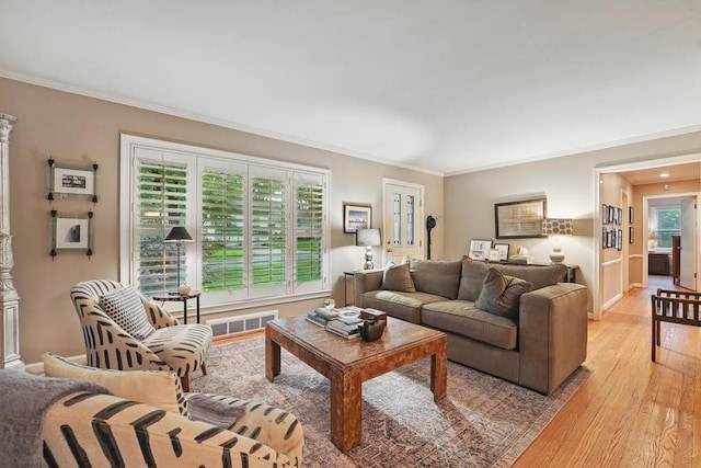 8604 Sagamore Rd, Leawood, KS 66206 - living area featuring light wood finished floors and crown molding